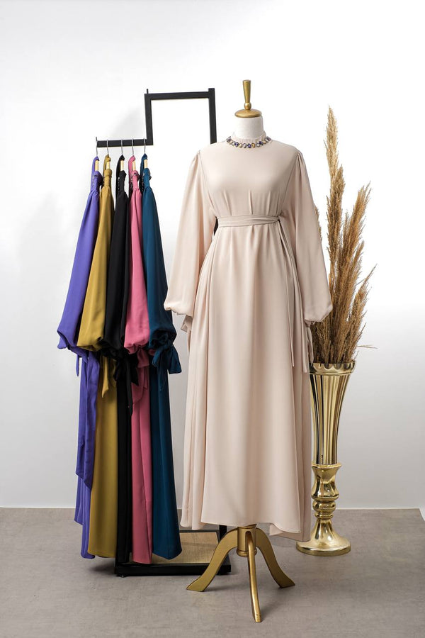 A dress with wide sleeves and a distinctive neckline. 7028